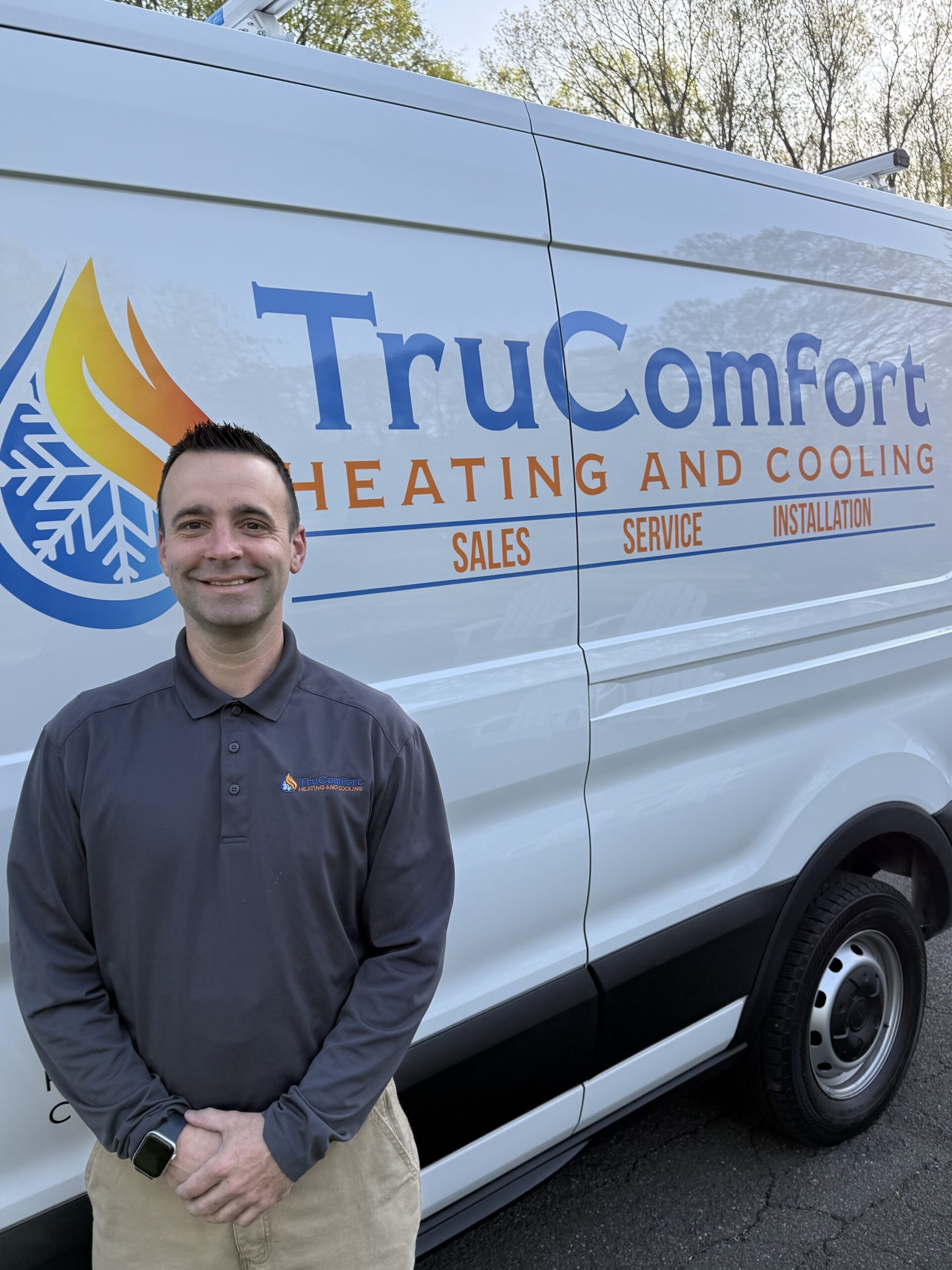 Eric, owner of Tru Comfort Heating and Cooling, standing next to his company van. He serves Southington, Cheshire, Plainville, and Wolcott, Connecticut.