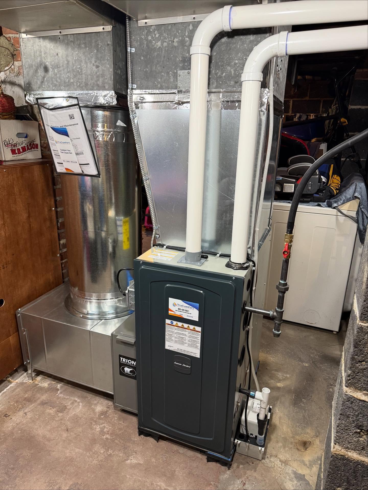 Newly installed high-efficiency American Standard furnace in Southington CT basement.